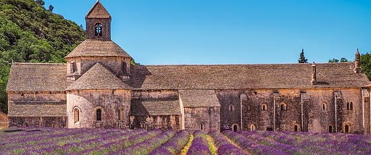 monastary with crops growing in the foreground